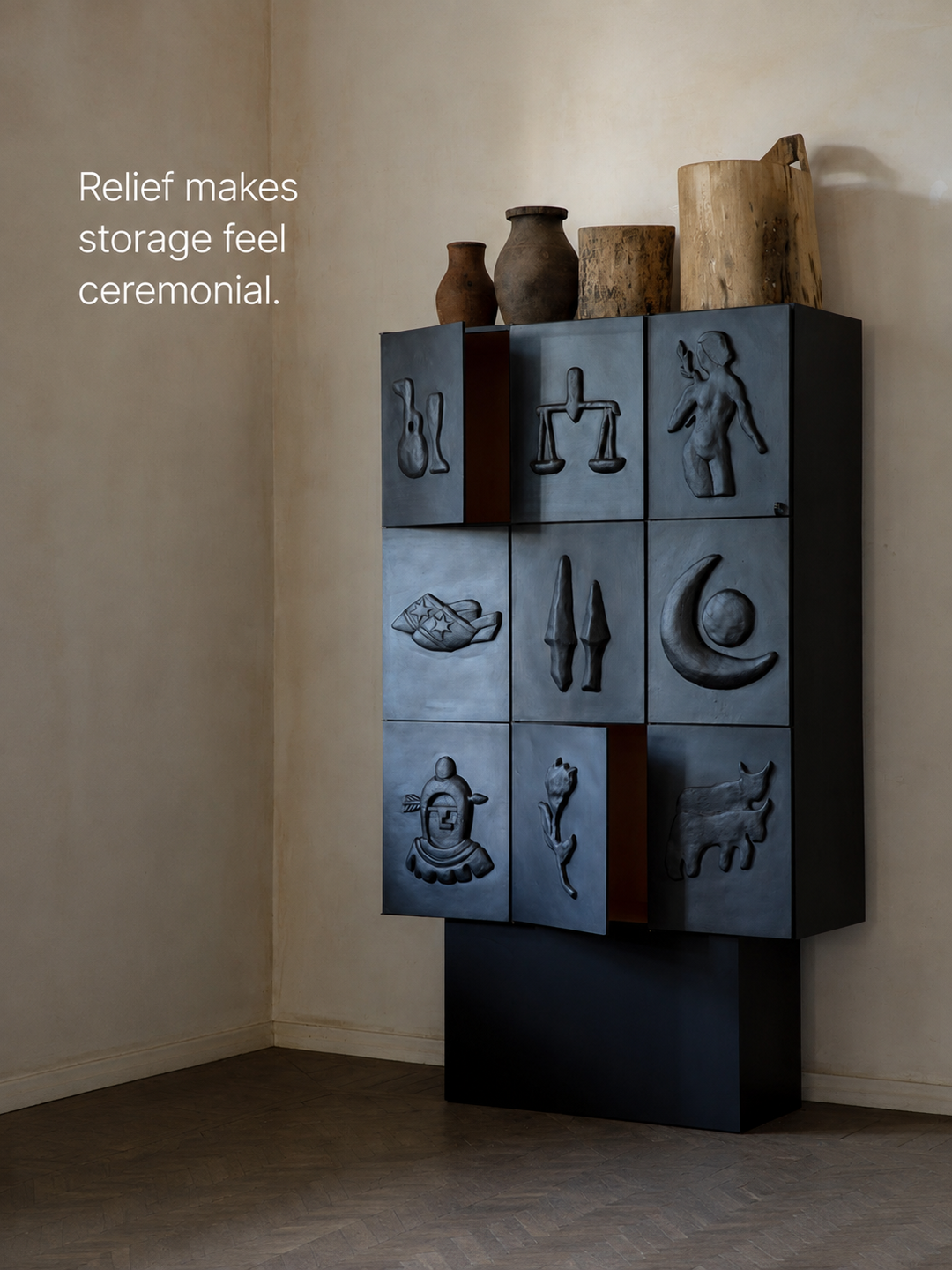 A sculptural iron cabinet with an observation about relief making storage feel ceremonial.
