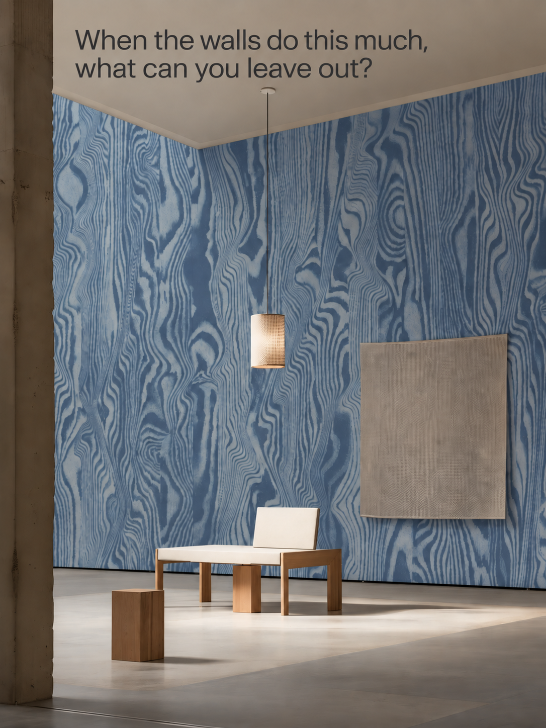 A blue wood-grain mural with the question: When the walls do this much, what can you leave out?
